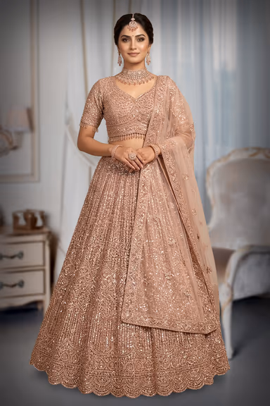Glamorous Rose Gold Lehenga Drenched In Heavy Sequin Work Featuring A Detailed Scalloped Border Blouse And… — view 2 of 3