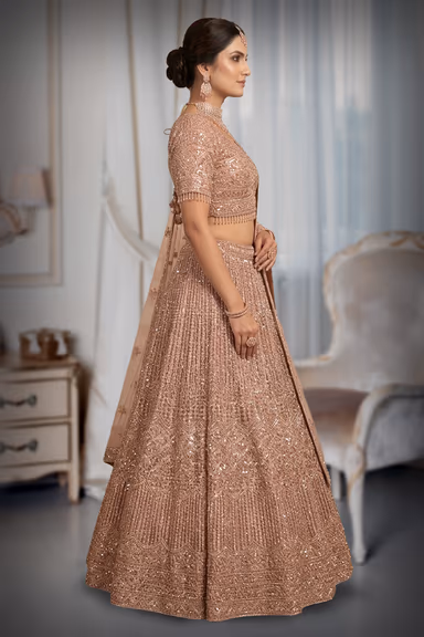 Glamorous Rose Gold Lehenga Drenched In Heavy Sequin Work Featuring A Detailed Scalloped Border Blouse And… — view 3 of 3
