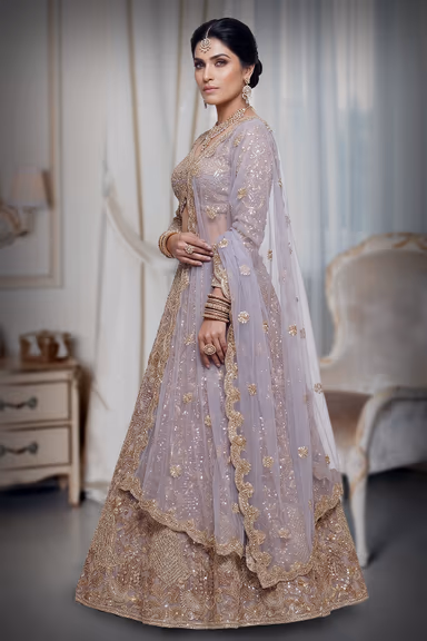 Exquisite Beige Lehenga Adorned With Heavy Gold Zari Work Intricate Floral Motifs And A Coordinating Sheer… — view 3 of 3