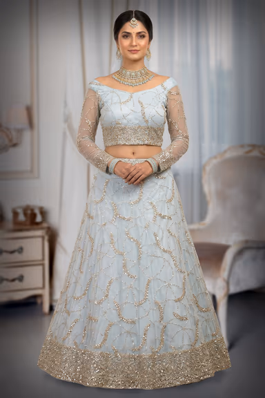 Elegant Light Blue Lehenga Featuring Intricate Silver Embroidery Sheer Full Sleeves And A Graceful Flowing… — view 2 of 3