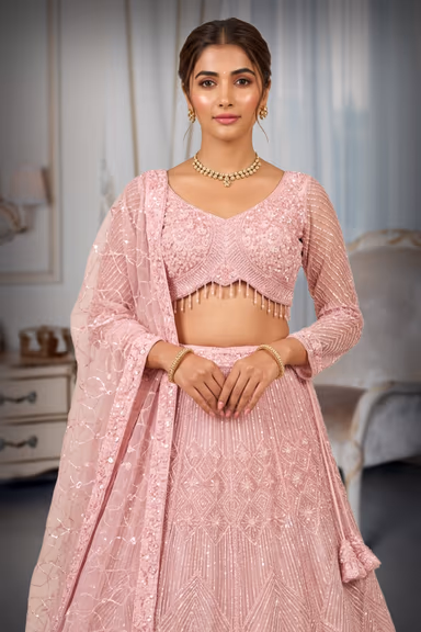 Pastel Pink Hand-Embellished Lehenga Choli with Geometric Sequin Pattern and Tassel Detail — view 1 of 2