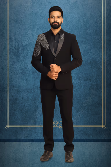 Black Grooms Tuxedo With Golden Handworked Details On Collar And Right Shoulder — view 1 of 2
