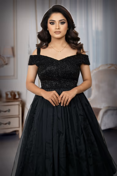 Exquisite Black Evening Gown Featuring A Shimmering Embellished Bodice And A Voluminous Flowing Skirt For A… — view 1 of 5