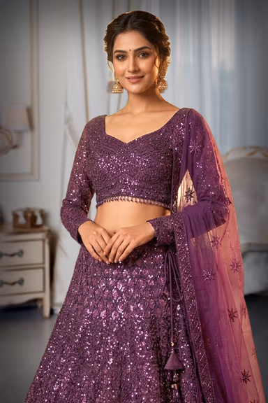 Graceful Grape Wine Lehenga Choli Set Detailed With Delicate Floral Embroidery And Shimmering Accents — view 1 of 2