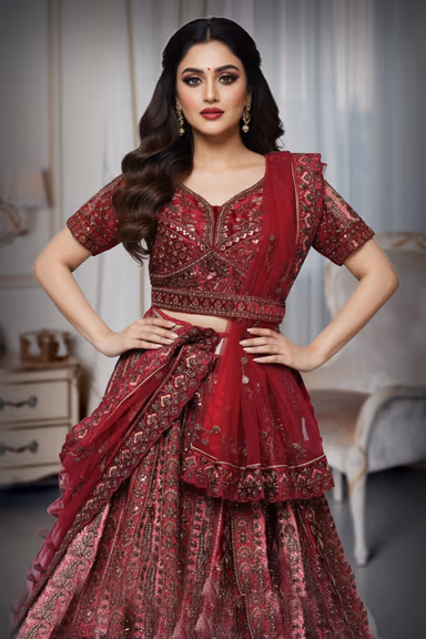 Heavy peachish red stoned lehenga — view 1 of 4