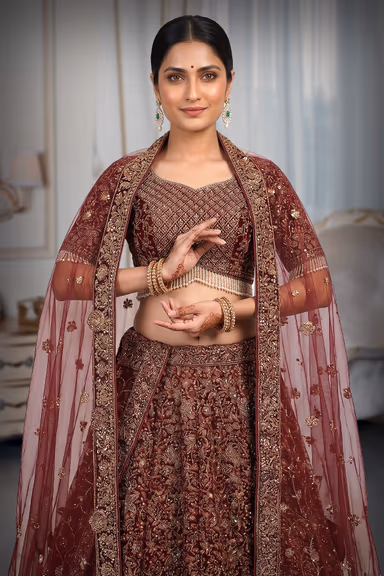 Red Heavy Handworked Bridal Lehenga With Golden Embellishments All Over The body And Beads Hanging In… — view 1 of 3