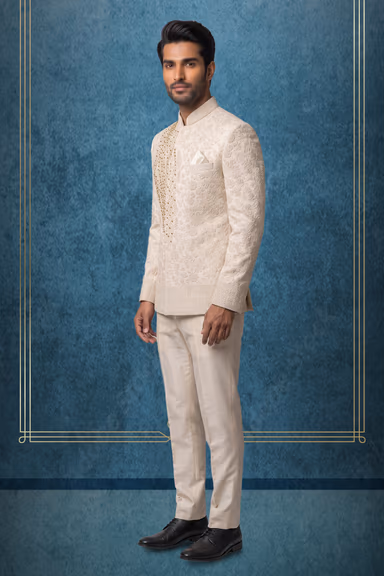 "Elegant Cream Jodhpuri Set Featuring Intricate Gold Embroidery. Includes Matching Kurta, Trousers, And… — view 3 of 3