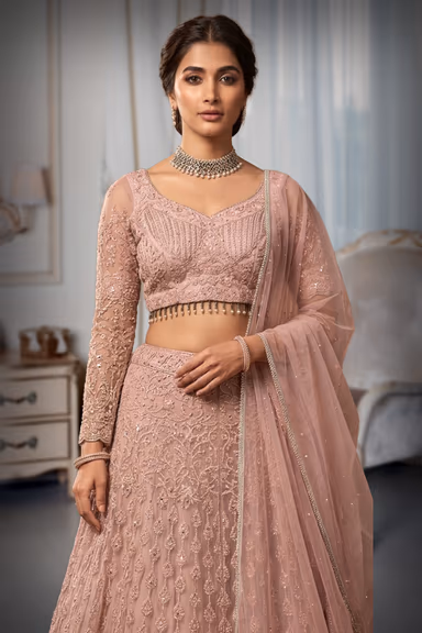 Baby Pink Pre Wedding Lehenga With Embroidery And Stone work Details All Over The Skirt And Crop Top — view 1 of 2
