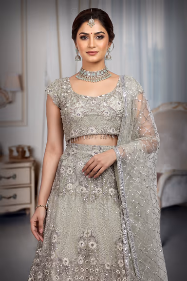Beige Colour Crop Top Lehenga With Heavy Detailed Skirt With Floral Designs And Sleeveless Blouse — view 1 of 3