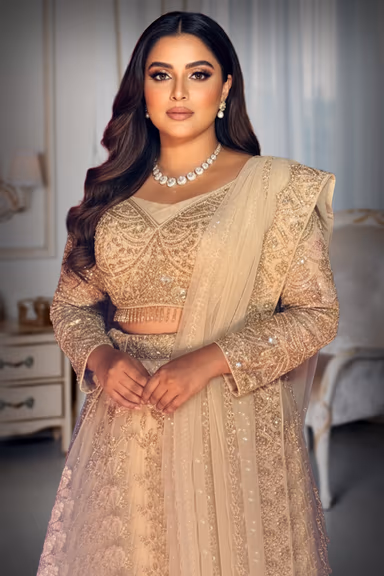 Beige colour Lehenga with Pinkish Tone , Heavy stone and Bead worked Skirt and Tops with Hanging Drops along… — view 1 of 2