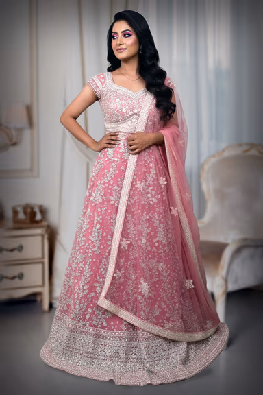 Graceful Peach Lehenga Choli Set Detailed With Delicate Floral Embroidery And Shimmering Accents — view 2 of 3