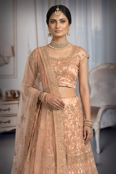 Gulnoor Peach Embroidered Zari Lehenga Set With Net Dupatta — view 1 of 3