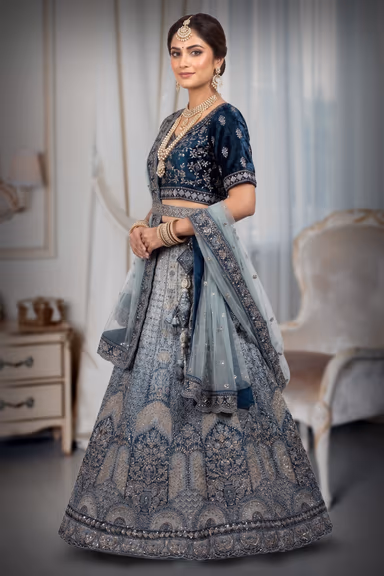 Traditional, heavily embroidered blue lehenga choli — view 3 of 3