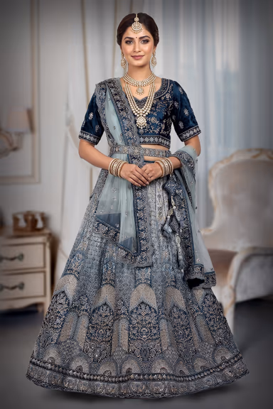 Traditional, heavily embroidered blue lehenga choli — view 2 of 3