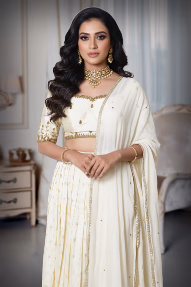 Elegant Off White Wedding Lehenga With Gold Embroidery And Plain Dupatta Suitable For Festive Functions — view 1 of 4