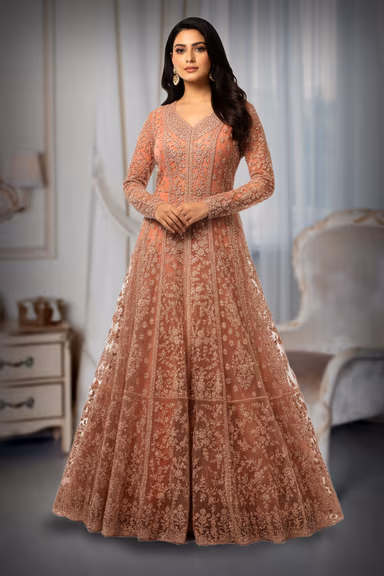 Pastel Peach Gown Features Intricate Stone Embellishments Detailed Embroidery And A Matching Sheer Net… — view 2 of 5