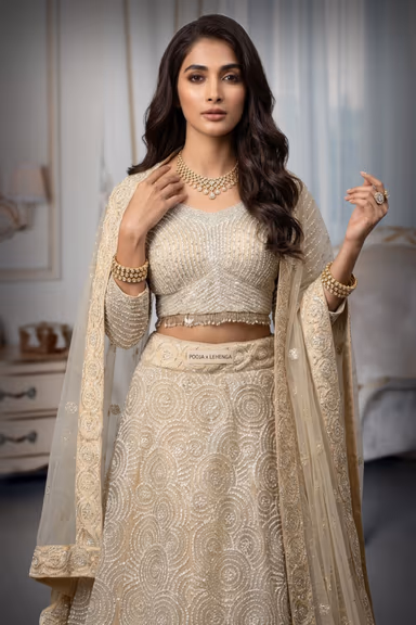 Pearl White Heavy Bridal Lehenga With Stone Work And Pearl Detaii Embellishment — view 1 of 3
