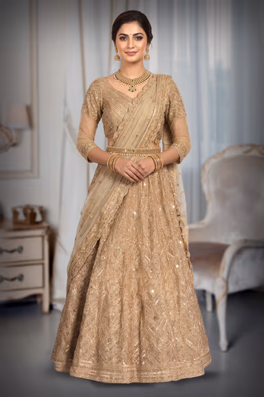 A Radiant Gold Lehenga With Detailed Mirrorwork And Zari, Paired With A Soft Net Dupatta For An Elegant Finish. — view 6 of 6