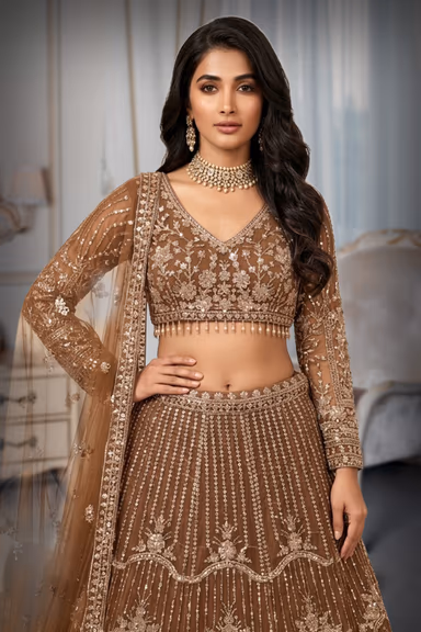 Regal Antique Gold Lehenga Set Showcasing Elaborate Zari Embroidery, Floral Motifs, And A Sheer Dupatta — view 1 of 2