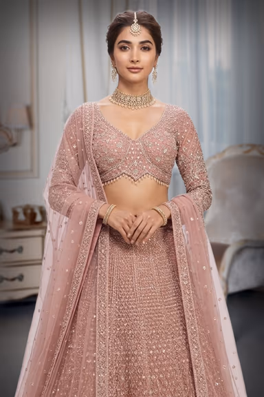 Regal Blush Pink Heavily Embellished Net Lehenga Choli with Gold Zari & Sequin Detail — view 1 of 2