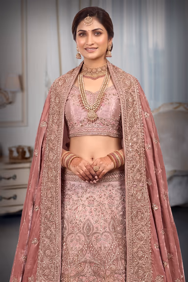 Regal bridal Lehenga In Rich Shades Of Dusty Rose And Mauve. — view 1 of 3