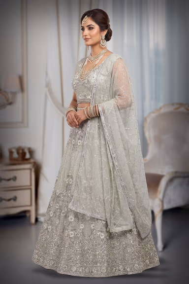 Sage Green Crop Top Lehenga With Heavy Detailed Skirt With Floral Designs And Sleeveless Blouse — view 3 of 3