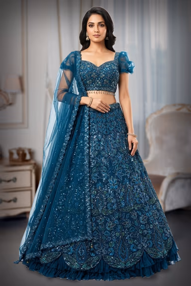 Elegant Teal Blue Lehenga Showcasing Delicate Leafy Embroidery And Silver Work Ideal For Festive Occasions… — view 2 of 2