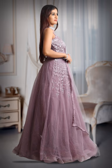 Dark mauve colour gown with heavy stone work as extension from the yoke — view 4 of 5