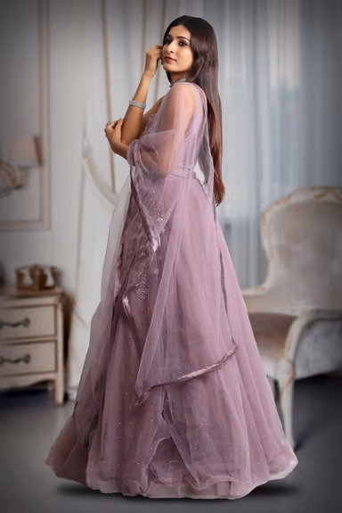 Dark mauve colour gown with heavy stone work as extension from the yoke — view 3 of 5
