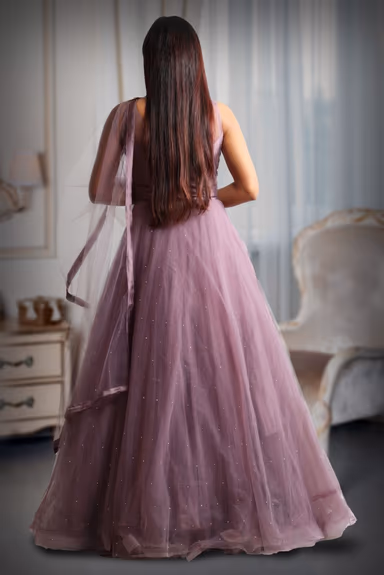 Dark mauve colour gown with heavy stone work as extension from the yoke — view 5 of 5