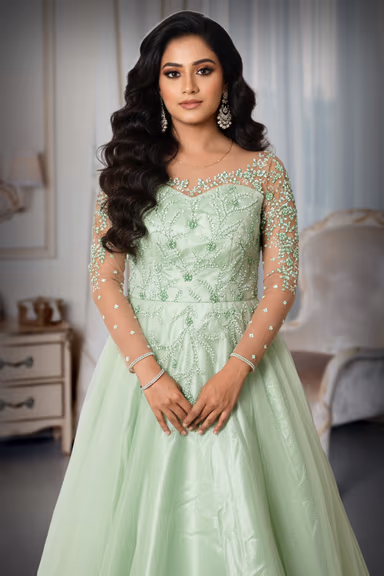 Light Mint Green Gown With Beaded Embellishments Sheer Sleeves And Flowing Tulle Skirt Excellent For An… — view 1 of 5