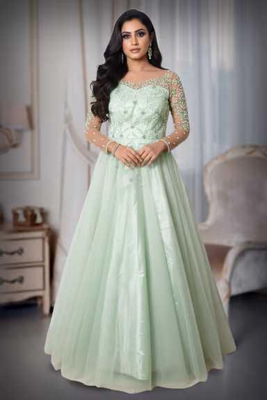 Light Mint Green Gown With Beaded Embellishments Sheer Sleeves And Flowing Tulle Skirt Excellent For An… — view 2 of 5