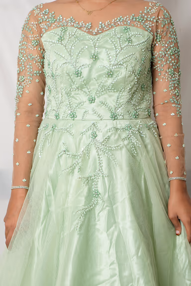 Light Mint Green Gown With Beaded Embellishments Sheer Sleeves And Flowing Tulle Skirt Excellent For An… — view 5 of 5