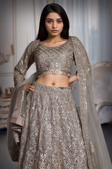 Metallic Golden Heavy Stone Worked Net Lehenga With Heavy Detailed Crop Top And Same Color Dupatta — view 1 of 3