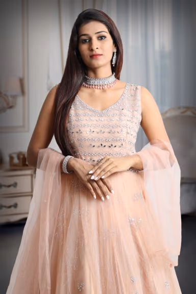 Pastel peach mirror work net gown with exquisite detailing on yoke and dupatta in same colour — view 1 of 5