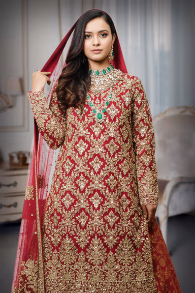 A Perfect Blend Of Tradition And Modernity Defines This Heavy Dark Red Bridal Lehenga — view 1 of 5