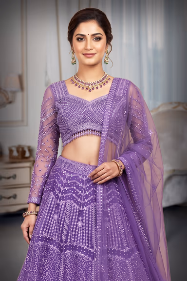 Regal Purple Net Lehenga With Stone Work Details And Raindrop Beads Detailing In Waist Line With Same Color… — view 1 of 4