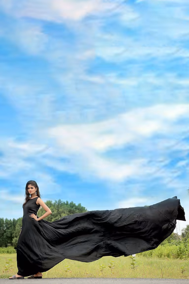 Black Satin Sleeveless Gown With Minimal Yoke And Flarey Back Tail — view 1 of 4