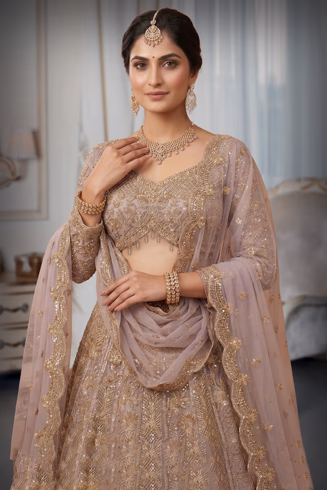 Exquisite Beige Lehenga Adorned With Heavy Gold Zari Work Intricate Floral Motifs And A Coordinating… — rent in Calicut