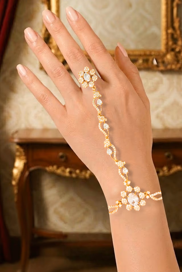 An Elegant Gold Haath Phool Featuring Intricate Floral Motifs Studded With Sparkling Diamonds — rent in Calicut