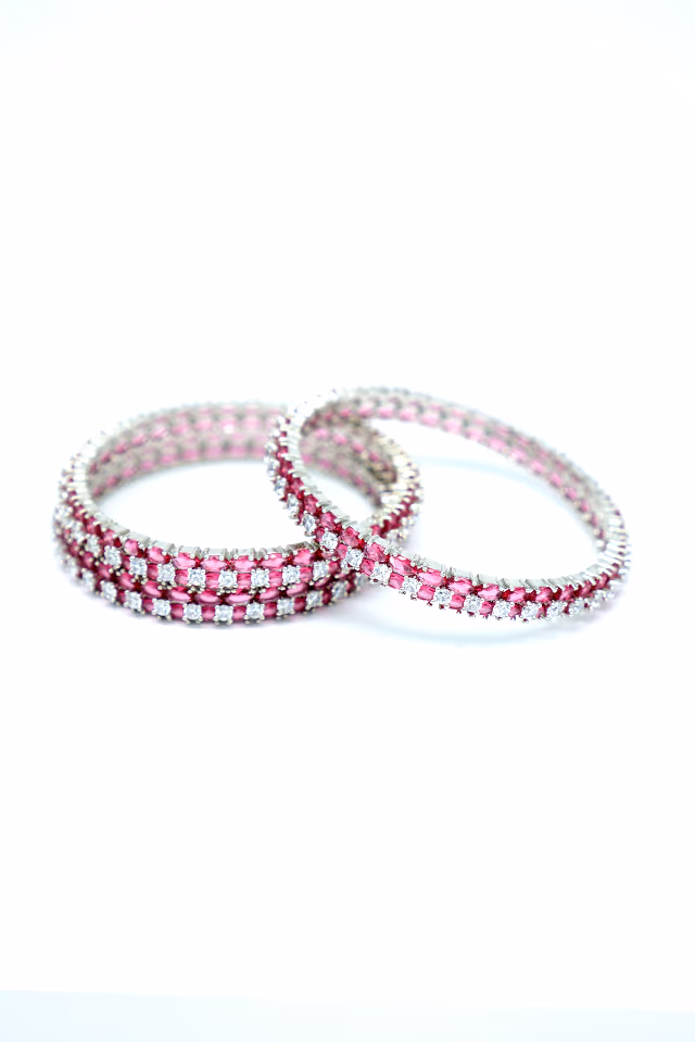 Add A Touch Of Sophistication To Your Look With These Sparkling Dark Pink And Silver Toned Bangles — rent in Calicut