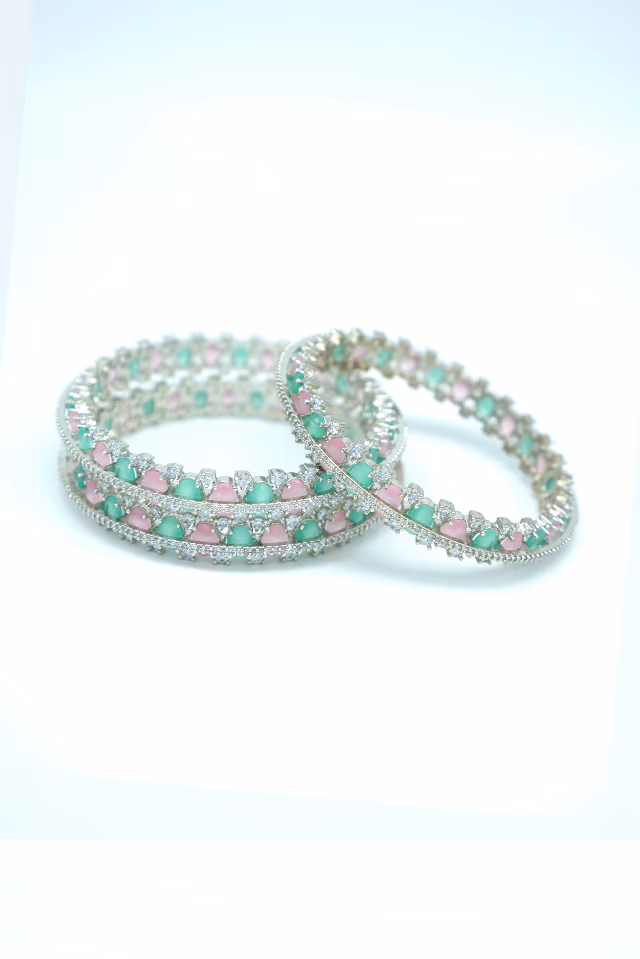 Adorn Your Wrist With These Stunning Green And Pink Gemstones Surrounded By Brilliant Shimmering Lab… — rent in Calicut