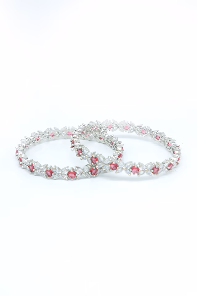 Beautiful Bangles Feature Ornate Silver Settings Enhancing The Natural Beauty Of Red Stones — rent in Calicut