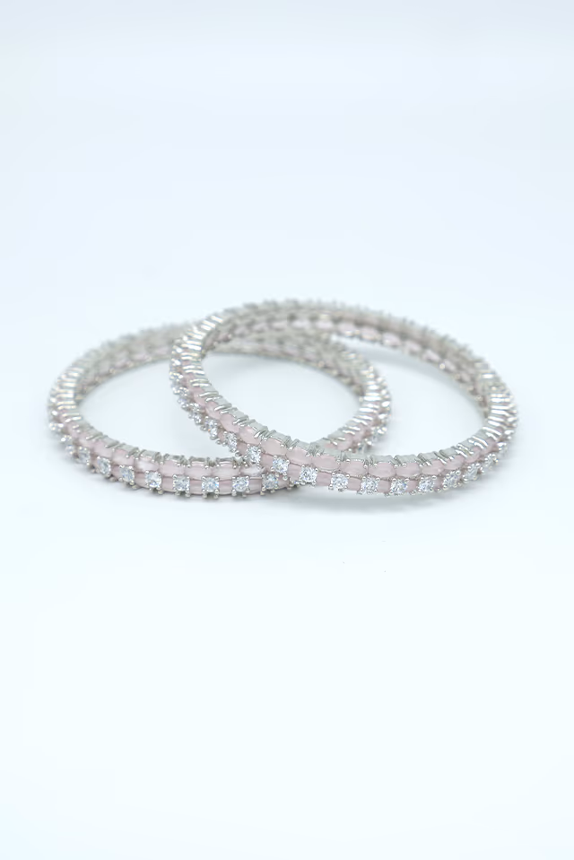Exquisite Pink Gemstone Bangles Are Precisely Crafted To Offer A Lightweight Feel Without Compromising On… — rent in Calicut