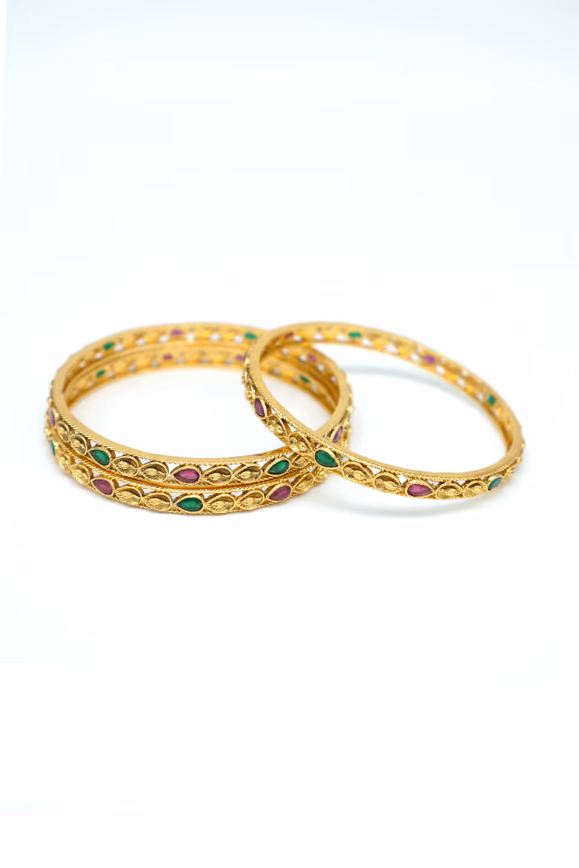 Exquisitely Carved Gold Bangle That Features Sacred Symbols And Elaborate Detailed Engraving — rent in Calicut