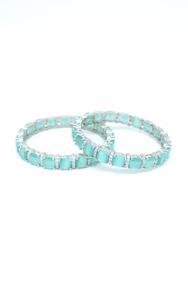 Luxurious Sea Green Stone Bangles Designed With A Brilliant Silver Finish For A Truly Stunning Jewelry… — rent in Calicut