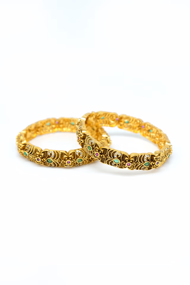 Magnificent Antique Gold Temple Bangle Features Intricate Divine Carvings And Traditional Sacred Motif… — rent in Coimbatore