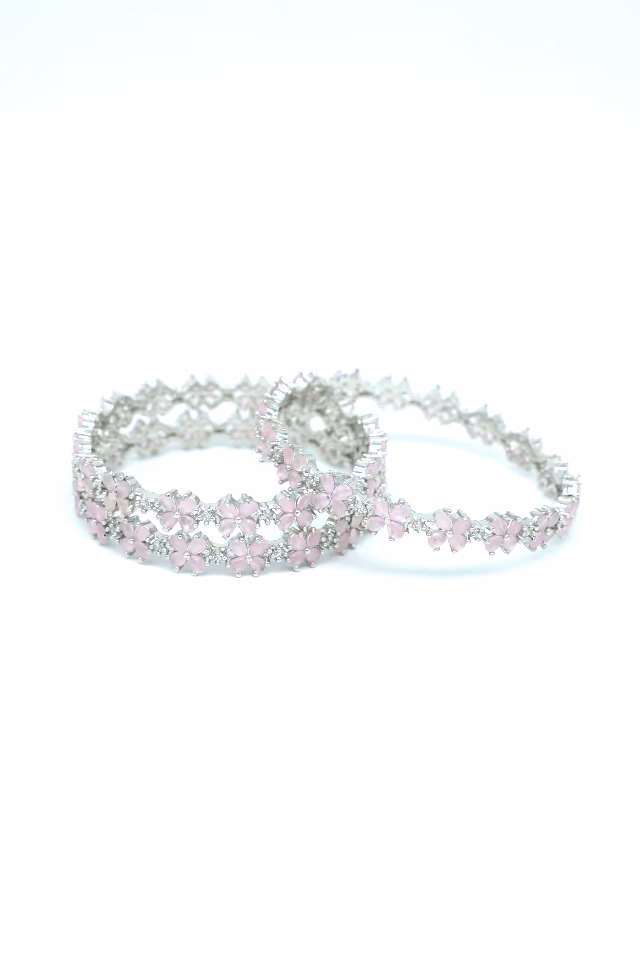 Sophisticated Silver Bangles Feature Alternating Pink And White Stones For A Balanced Look Of… — rent in Calicut