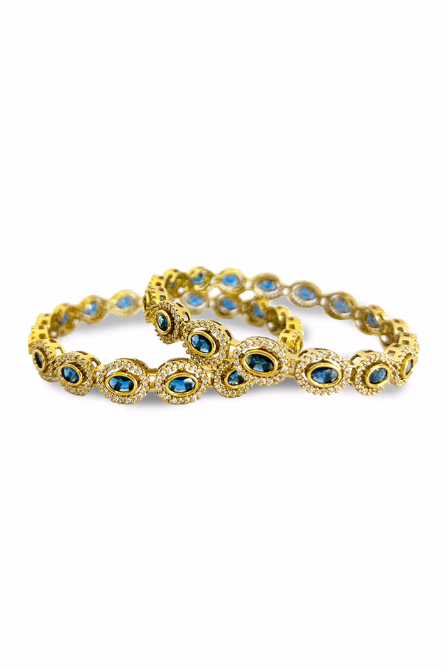 Adorn Your Wrists With This Timeless Pair Of Gold Toned Bangles Designed For Royal Elegance — rent in Bangalore