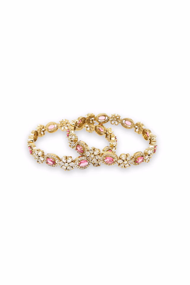 Enhance Your Beauty With These Radiant Silver Bangles Featuring Red Gemstones And Intricate Stone Settings — rent in Calicut